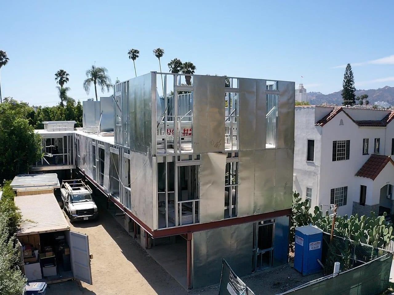 A multi-story residence framed in light gauge steel, seen from above in a Los Angeles neighborhood.
