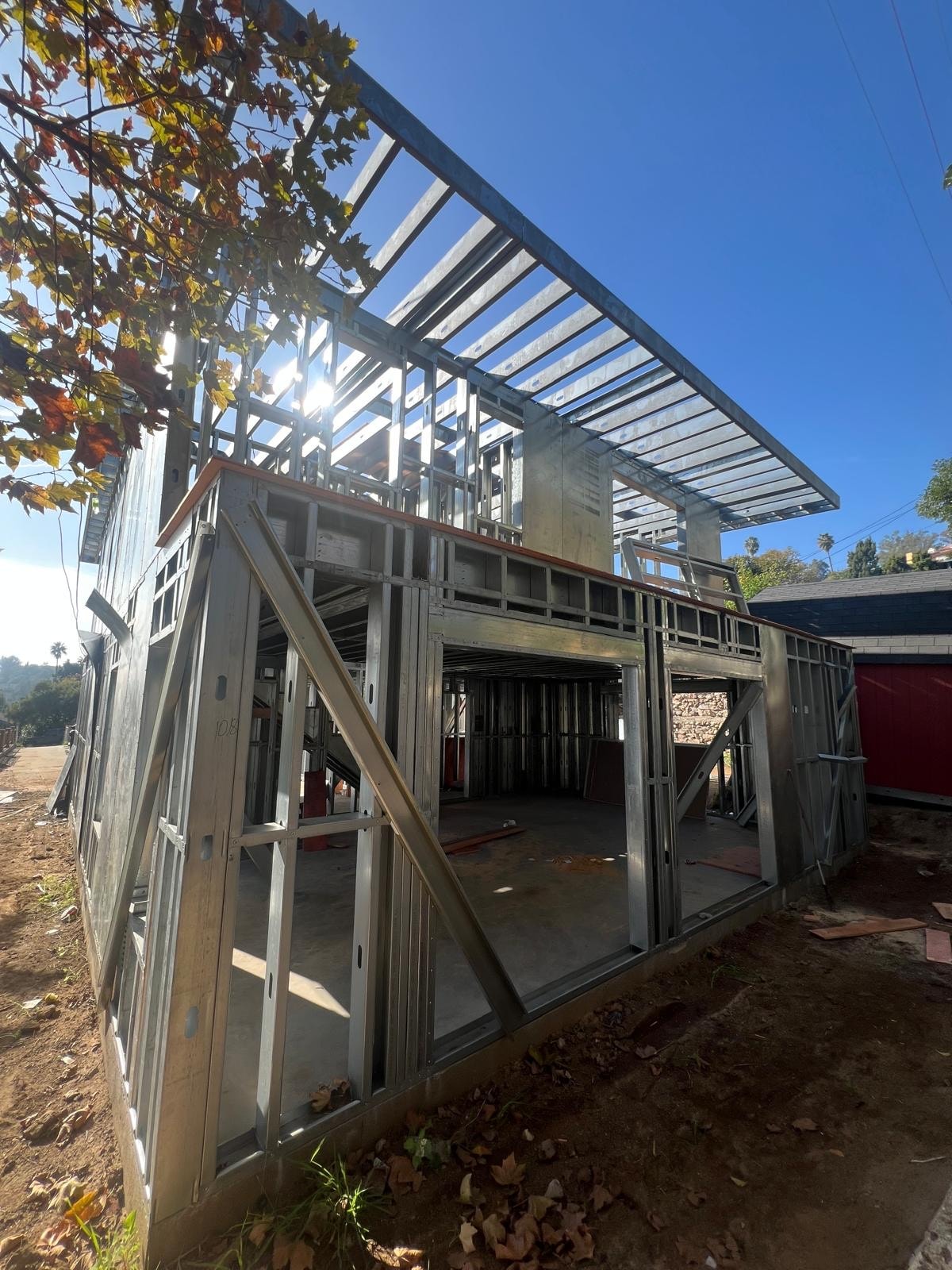 A two-story single-family ADU framed in light gauge steel during construction.