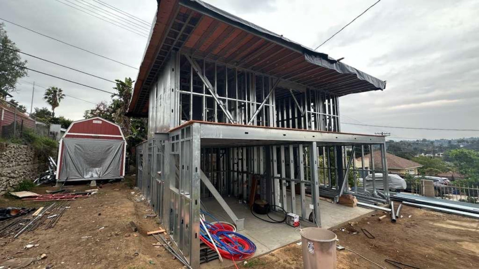 A two-story single-family ADU nearing completion, framed in light gauge steel.